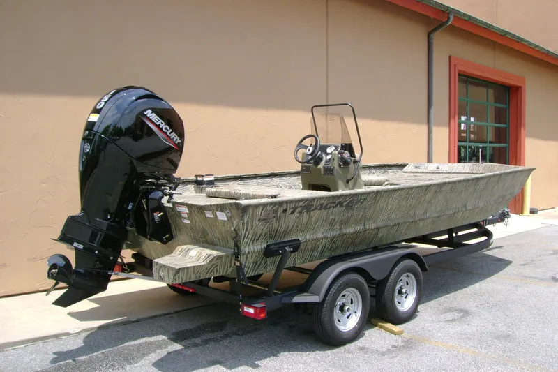 Slide: The Image of 2026 Tracker Grizzly 2072 CC boat with Mercury outboard motor on trailer. - 2