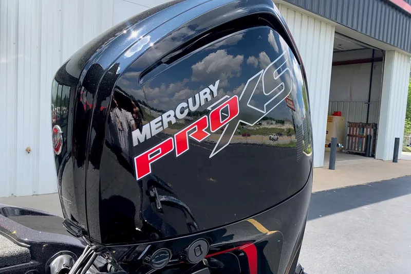 Slide: The Image of Mercury Pro XS engine on a 2026 Nitro Z17 boat, parked outside a garage. - 4