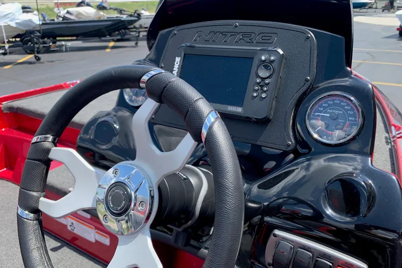 Slide: The Image of Steering wheel and dashboard of 2026 Nitro Z17 boat with navigation system. - 5