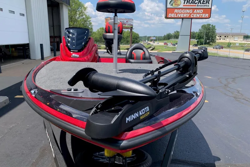 Slide: The Image of Red Nitro Z17 boat with Minn Kota Maxxum motor, parked at Tracker Boats center. - 1