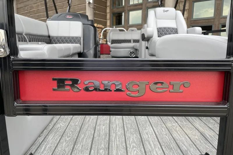 Slide: The Image of 2026 Ranger 223FC boat interior with logo, featuring sleek seating and modern design. - 2