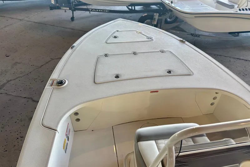 Slide: The Image of 2026 Mako 18 Pro Skiff boat interior, showcasing spacious deck and seating area. - 9