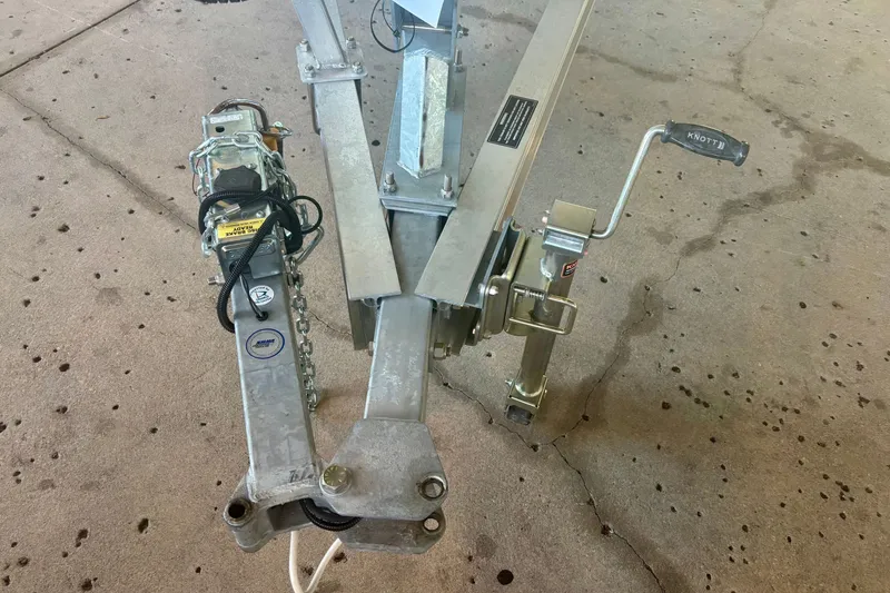Slide: The Image of Trailer hitch of 2026 Mako 18 Pro Skiff on concrete surface. - 3