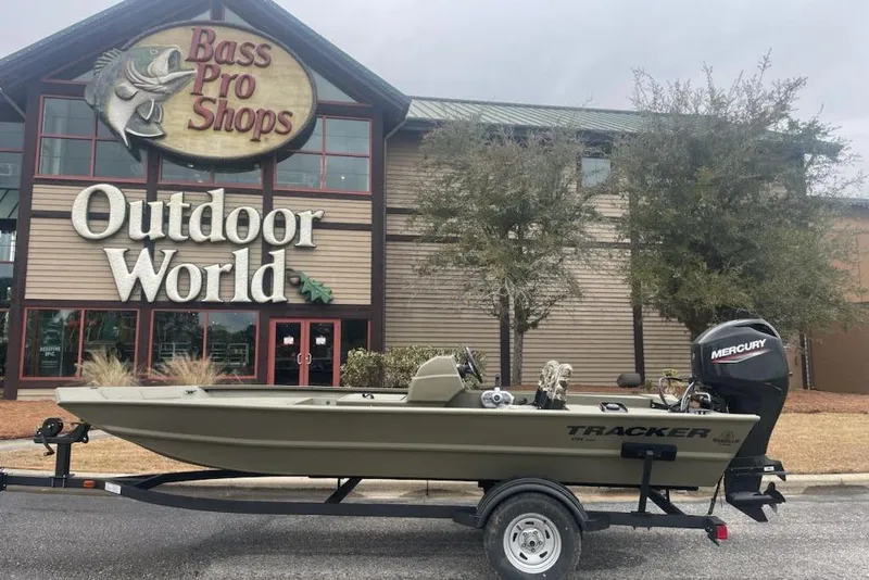 Slide: The Image of 2026 Tracker Grizzly 1754 SC boat outside Bass Pro Shops Outdoor World. - 5