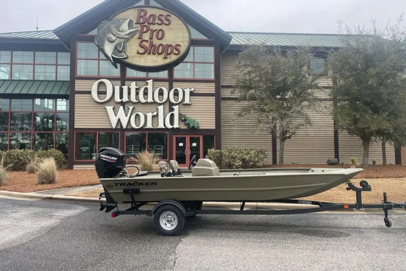 The Image of 2026 Tracker Grizzly 1754 SC boat on trailer outside Bass Pro Shops Outdoor World. - 0