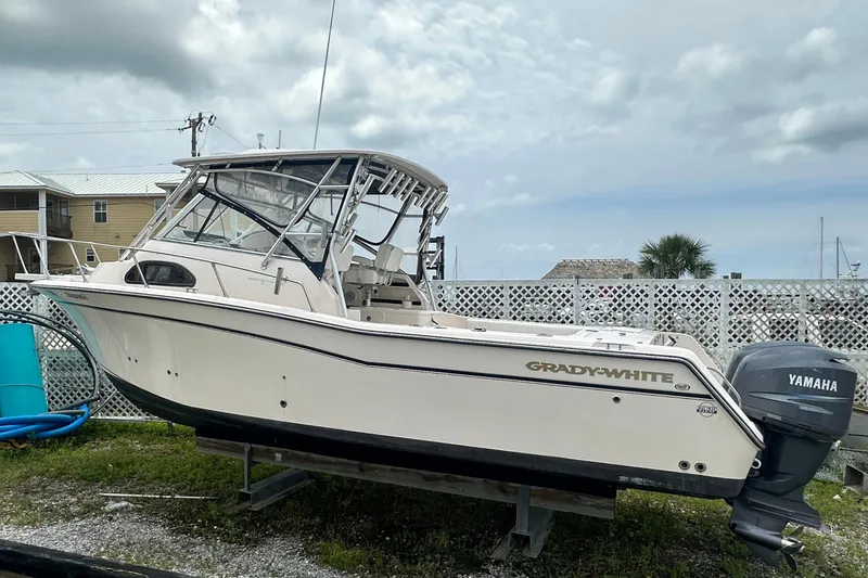 The Image of 2006 Grady-White Marlin 300 boat with Yamaha engine on display outdoors. - 0