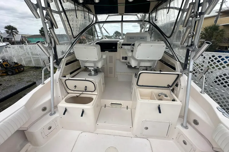 Slide: The Image of 2006 Grady-White Marlin 300 boat interior with seating and storage compartments. - 12