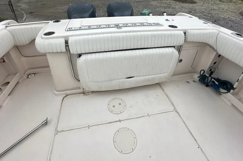 Slide: The Image of 2006 Grady-White Marlin 300 boat interior with white seating and deck layout. - 14