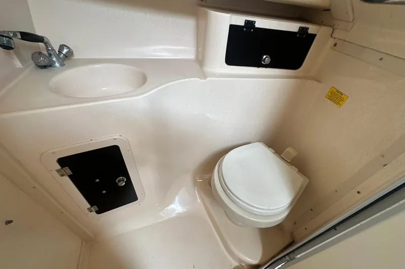 Slide: The Image of 2006 Grady-White Marlin 300 boat bathroom with sink and toilet. - 6