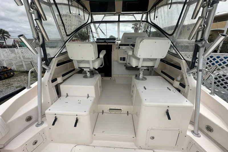 Slide: The Image of 2006 Grady-White Marlin 300 boat interior with helm and seating area. - 9