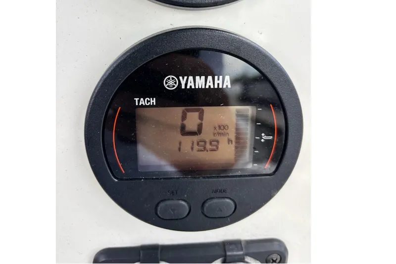 Slide: The Image of Yamaha tachometer displaying 0 RPM and 113.9 hours on a 2021 Stingray 216 CC boat. - 12