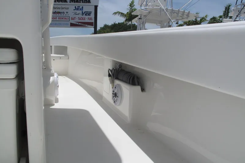 Slide: The Image of 2022 SeaVee 322Z boat interior with white deck and speaker detail. - 21