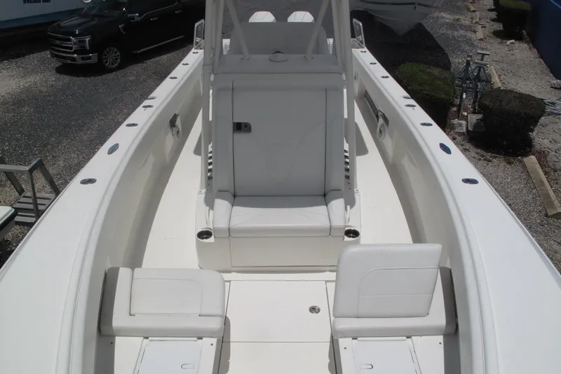 Slide: The Image of 2022 SeaVee 322Z boat interior with white seating and spacious deck layout. - 9