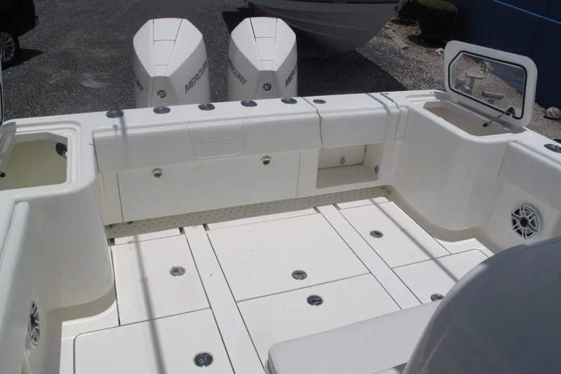 Slide: The Image of 2022 SeaVee 322Z boat deck with Mercury engines, featuring spacious storage and seating. - 14