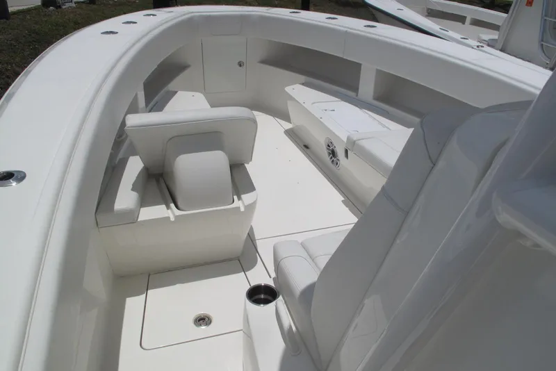 Slide: The Image of 2022 SeaVee 322Z boat interior with white seating and sleek design. - 12