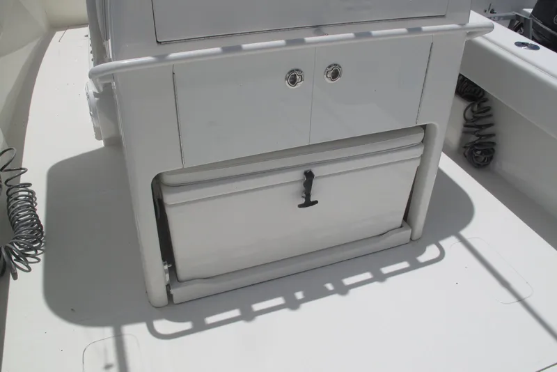 Slide: The Image of 2022 SeaVee 322Z boat interior with storage compartment and cooler. - 2