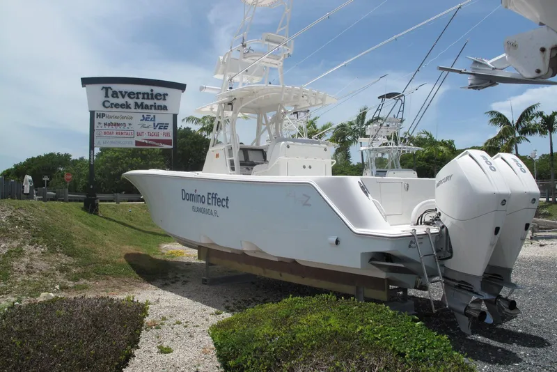 Slide: The Image of 2022 SeaVee 322Z boat at Tavernier Creek Marina, featuring twin Mercury engines. - 4