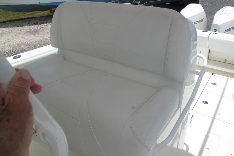 Slide: The Image of 2022 SeaVee 322Z boat with white cushioned seating and Mercury engines. - 17