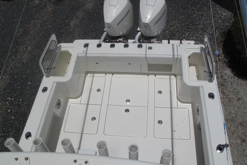Slide: The Image of 2022 SeaVee 322Z boat deck with twin Mercury engines and storage compartments. - 26