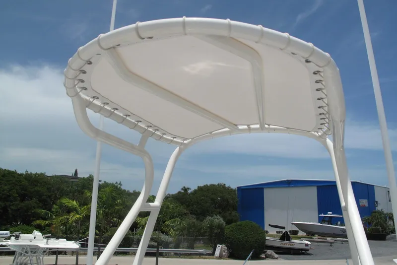 Slide: The Image of T-top canopy of 2022 SeaVee 322Z boat against blue sky background. - 27