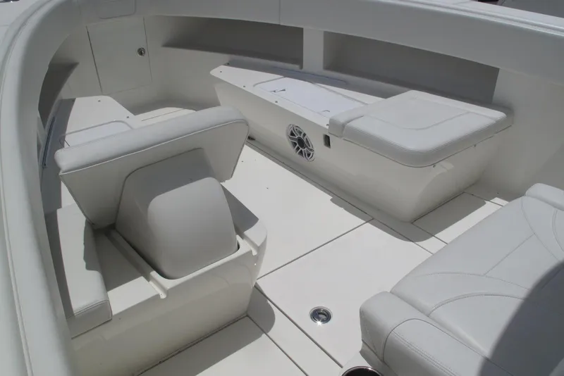 Slide: The Image of 2022 SeaVee 322Z boat interior with white seating and storage compartments. - 23