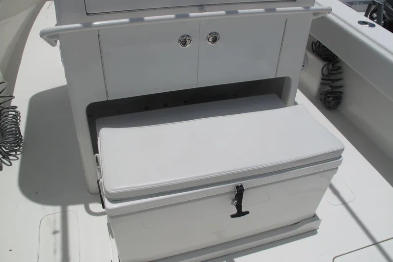 Slide: The Image of 2022 SeaVee 322Z boat interior with cushioned storage bench and sleek design. - 19