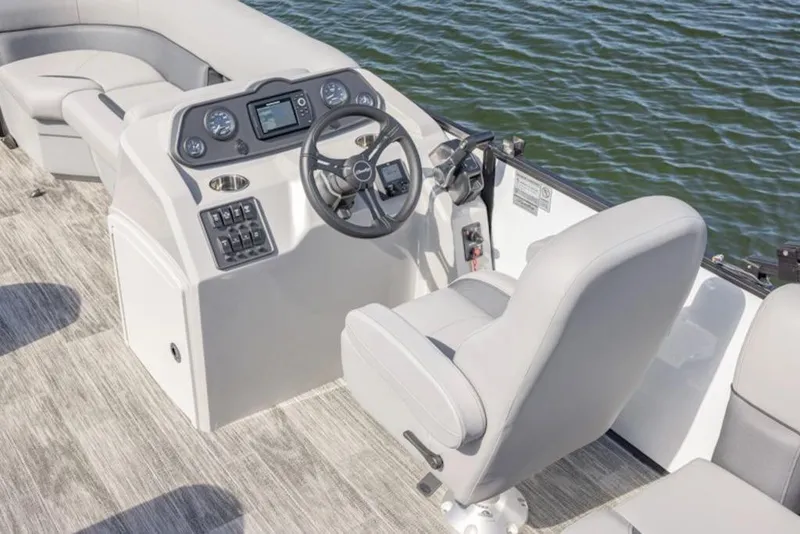 Slide: The Image of 2026 Bentley Pontoons LE 180 CR helm with modern controls and comfortable seating. - 4
