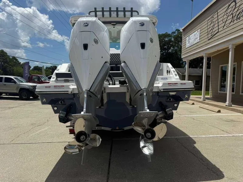 Slide: The Image of Two powerful outboard engines are mounted on the stern of a Monterey Elite 30 OB boat. - 6