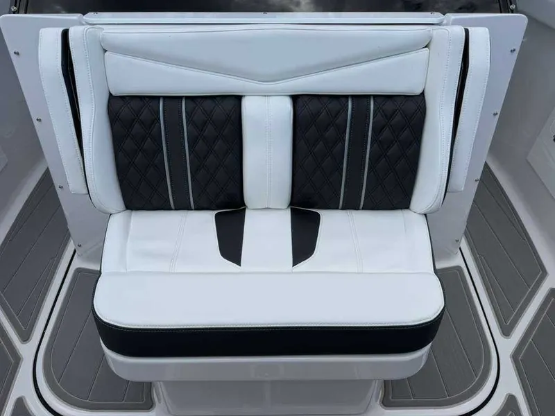 Slide: The Image of Elegant seating area with black and white upholstery and quilted design on a boat. - 20
