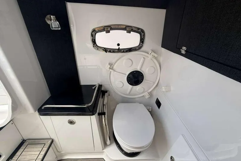 Slide: The Image of Modern bathroom interior of 2026 Monterey Elite 30 OB boat, featuring sleek design and compact amenities. - 35