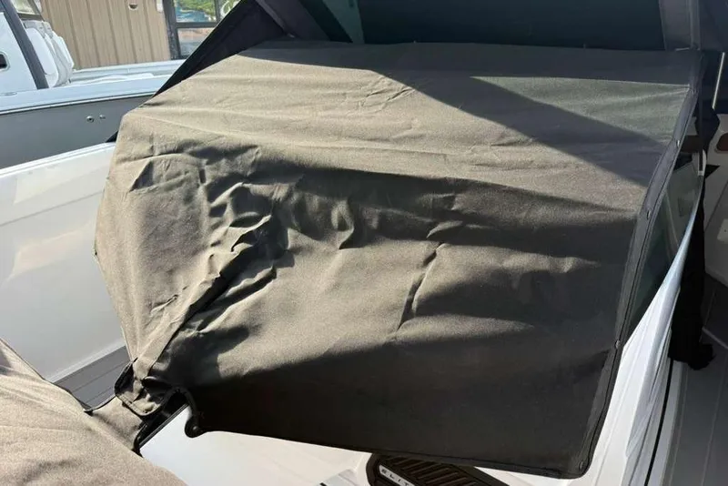Slide: The Image of Protective cover on a 2026 Monterey Elite 30 OB boat, showcasing interior protection. - 93