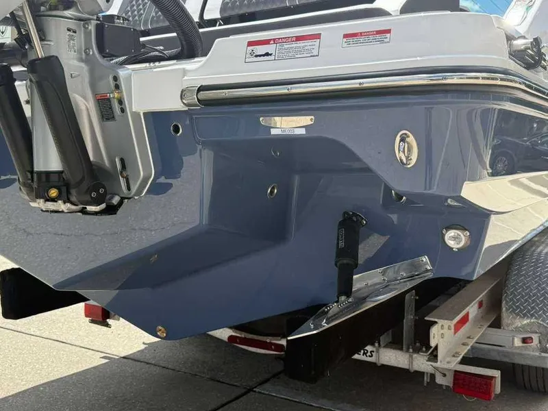 Slide: The Image of The image shows the stern of a Monterey Elite 30 OB boat on a trailer. - 8