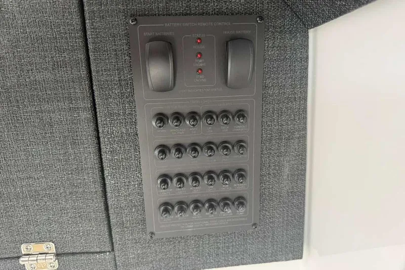 Slide: The Image of Control panel on 2026 Monterey Elite 30 OB boat, featuring switches and indicators. - 31