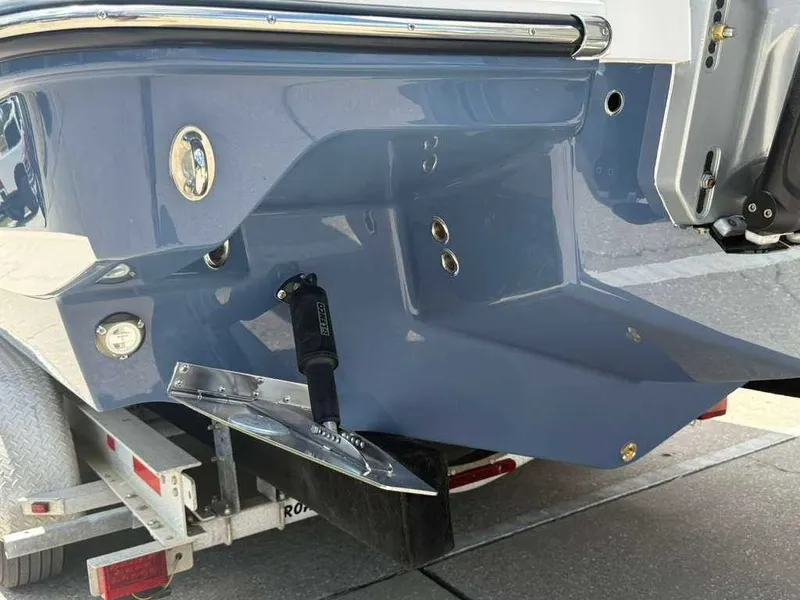 Slide: The Image of Close-up of the stern of a Monterey Elite 30 OB boat on a trailer. - 9