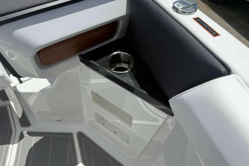 Slide: The Image of Interior detail of 2026 Monterey Elite 30 OB boat with cup holder and sleek design. - 51