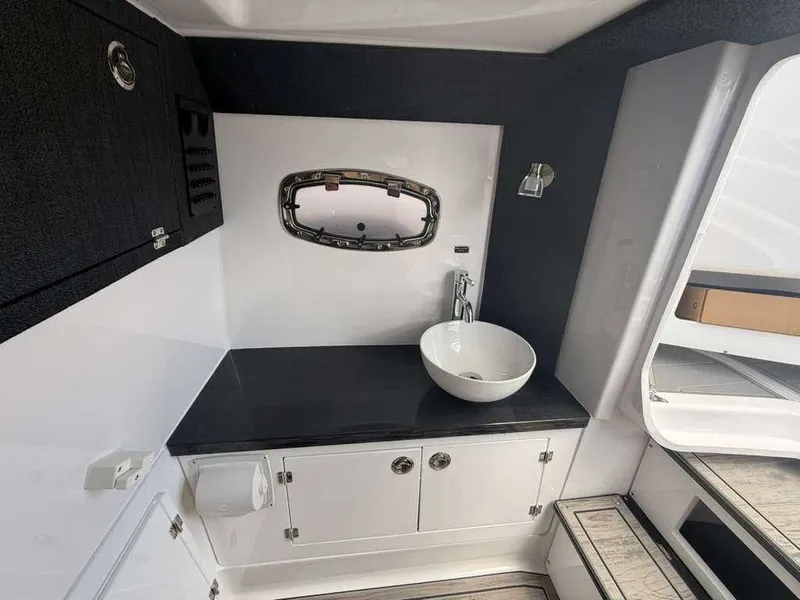 Slide: The Image of Interior of a modern boat cabin with a sink and window. - 16