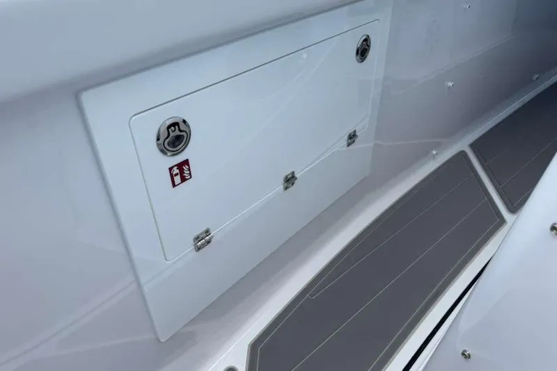 Slide: The Image of 2026 Monterey Elite 30 OB boat storage compartment with fire extinguisher symbol. - 39