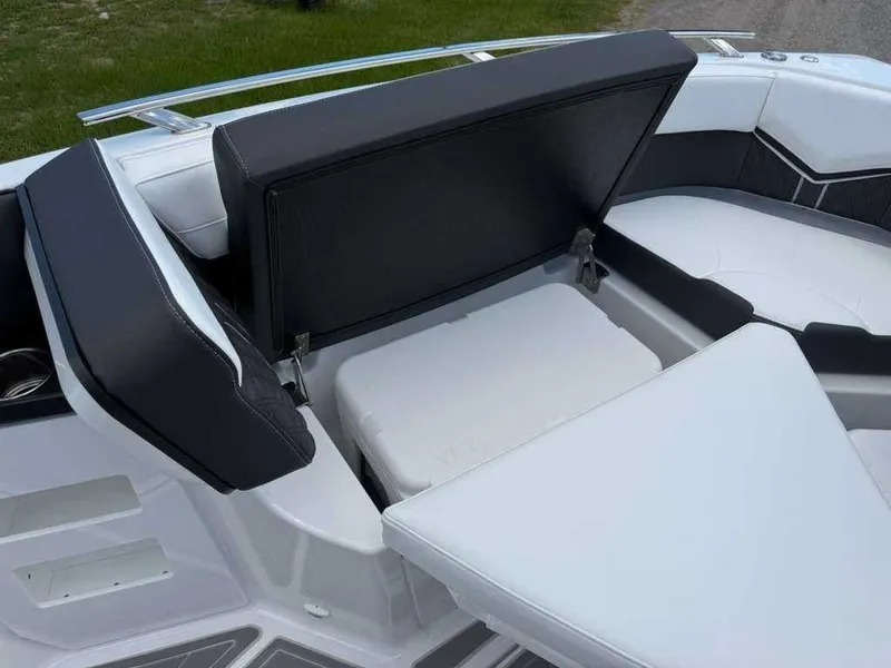 Slide: The Image of Seating area with storage on a Monterey Elite 30 OB boat. - 24