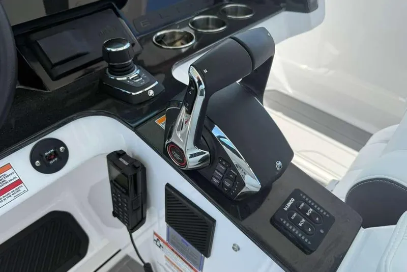 Slide: The Image of Control panel of 2026 Monterey Elite 30 OB boat with joystick and throttle. - 69