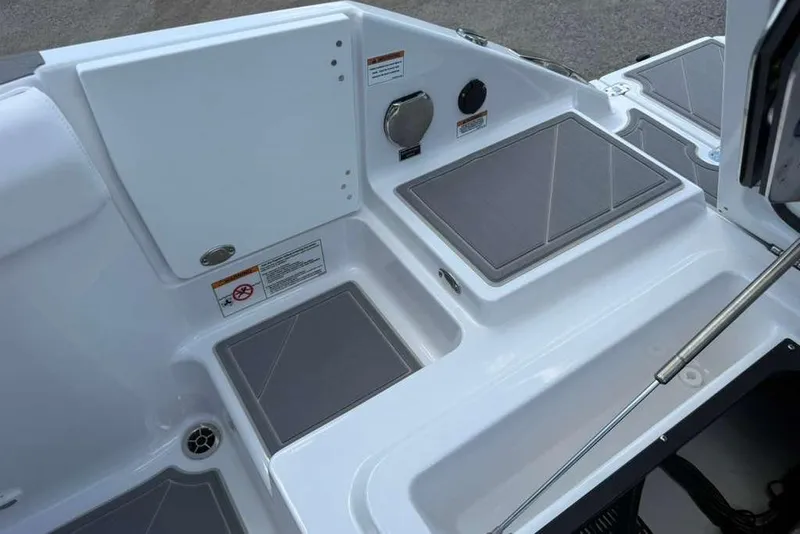 Slide: The Image of 2026 Monterey Elite 30 OB boat deck with storage compartments and sleek design. - 61