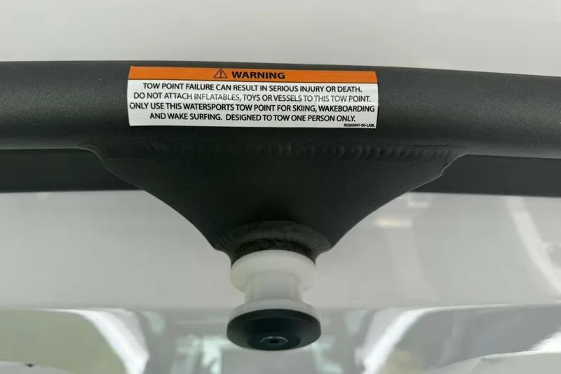 Slide: The Image of Warning label on 2026 Monterey Elite 30 OB tow point for watersports safety. - 62