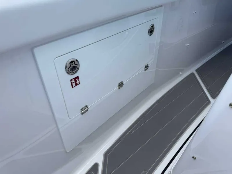 Slide: The Image of A storage compartment on a Monterey Elite 30 OB boat. - 21