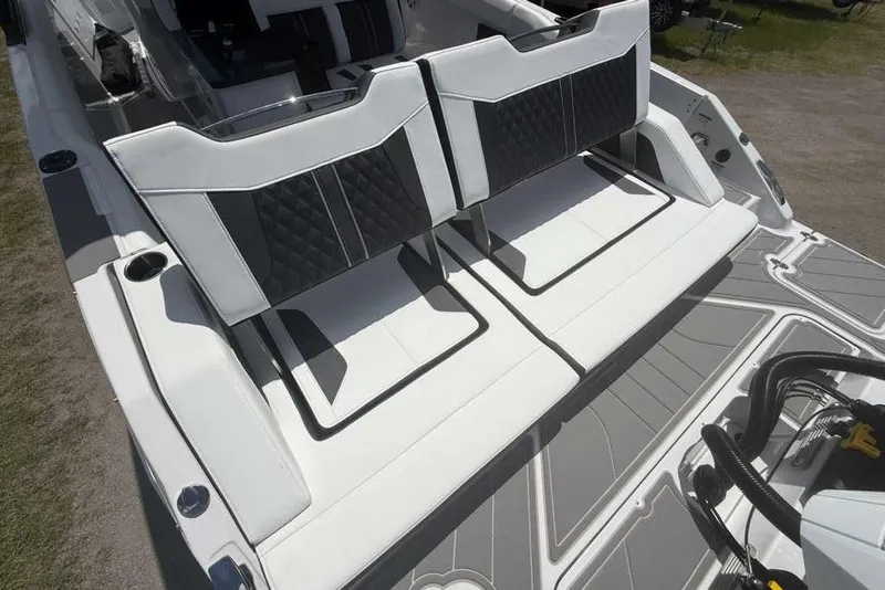 Slide: The Image of 2026 Monterey Elite 30 OB boat with stylish seating and modern design. - 82