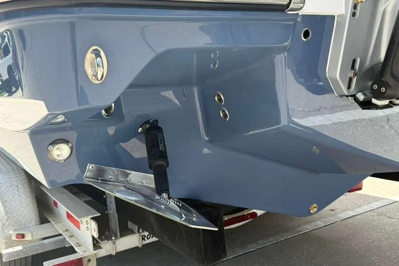 Slide: The Image of Rear view of a 2026 Monterey Elite 30 OB boat on a trailer. - 27