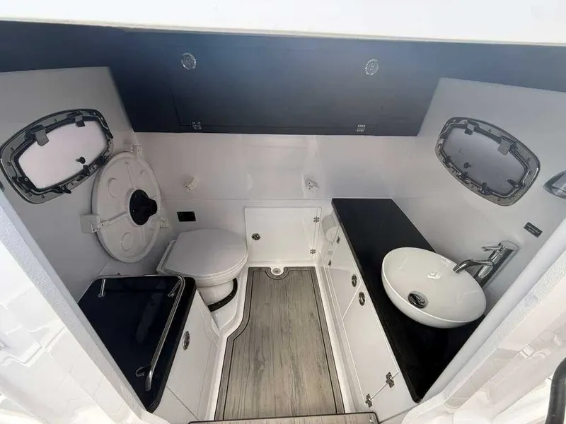 Slide: The Image of Interior of a modern boat cabin with a toilet and sink. - 18