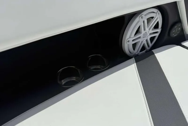 Slide: The Image of 2026 Monterey Elite 30 OB boat interior with speaker and cup holders. - 48