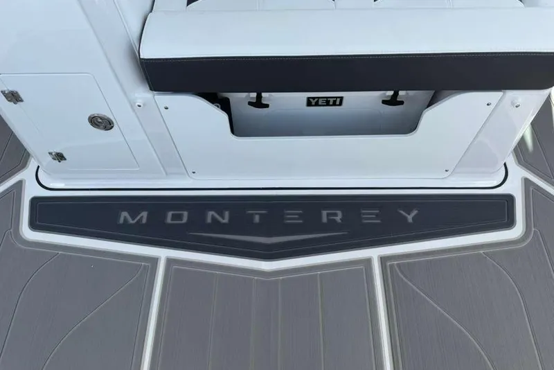 Slide: The Image of 2026 Monterey Elite 30 OB boat deck with Yeti cooler storage. - 71