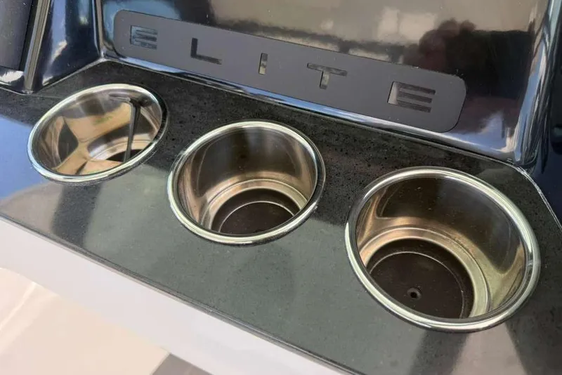 Slide: The Image of Cup holders on a 2026 Monterey Elite 30 OB boat dashboard. - 78