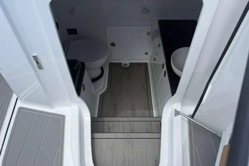 Slide: The Image of Interior of 2026 Monterey Elite 30 OB boat, featuring modern bathroom amenities. - 41