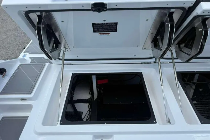 Slide: The Image of Open storage compartment of 2026 Monterey Elite 30 OB boat. - 56